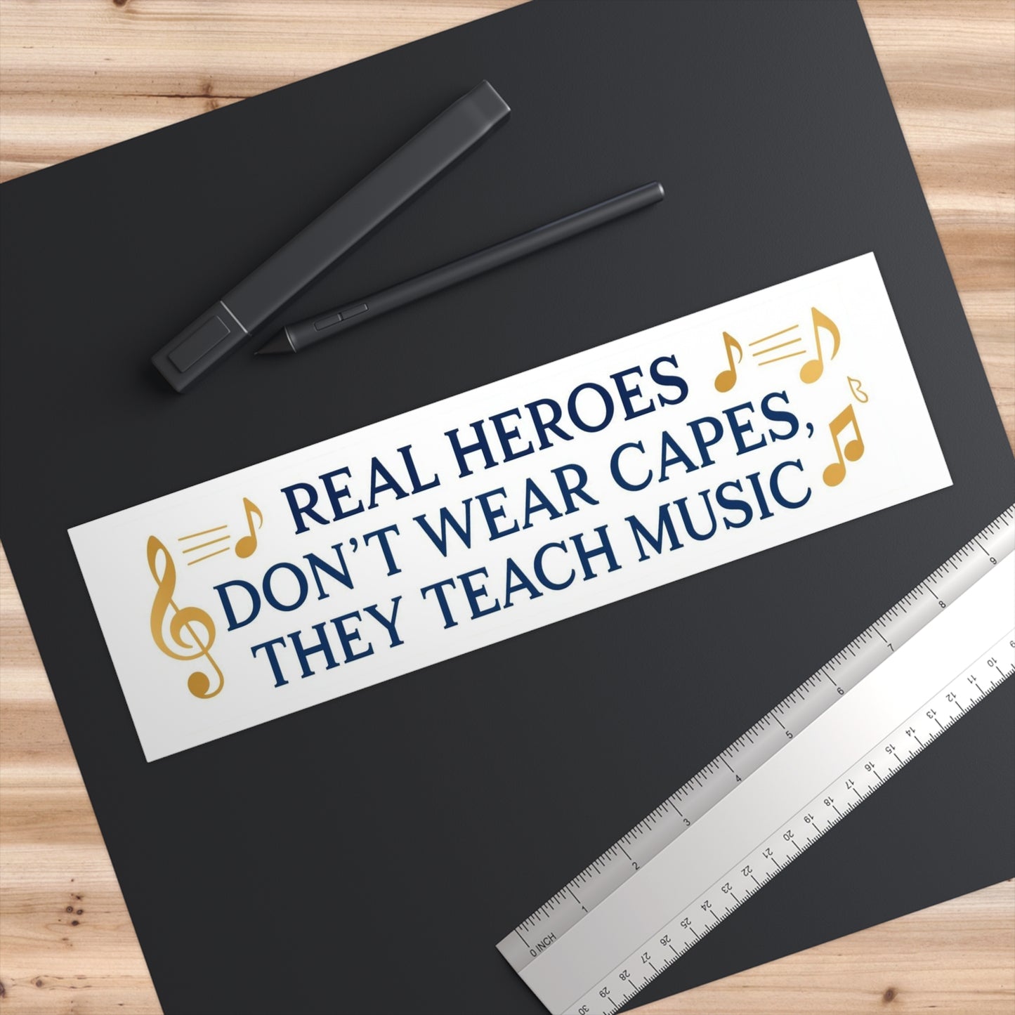 Bumper Sticker — "Real Heroes Don't Wear Capes, They Teach Music"